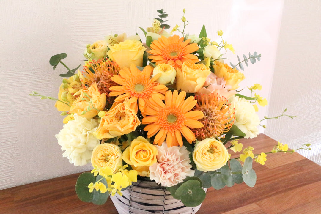 黄色・オレンジ色のアレンジメント 10,000円