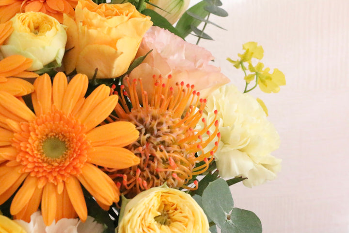 黄色・オレンジ色のアレンジメント 9,000円