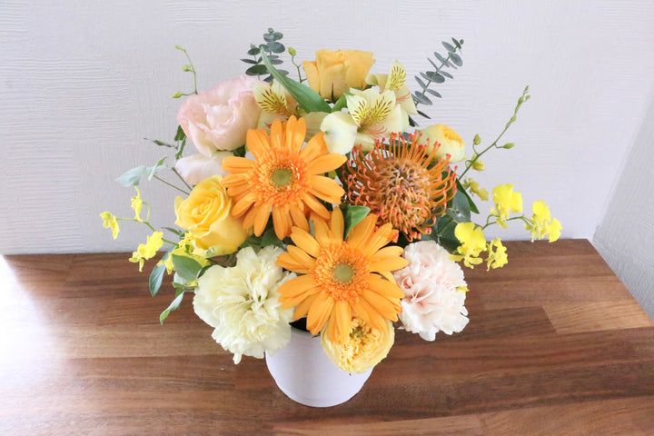 黄色・オレンジ色のアレンジメント 7,000円