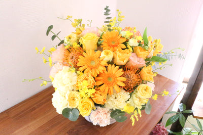 黄色・オレンジ色のアレンジメント 15,000円