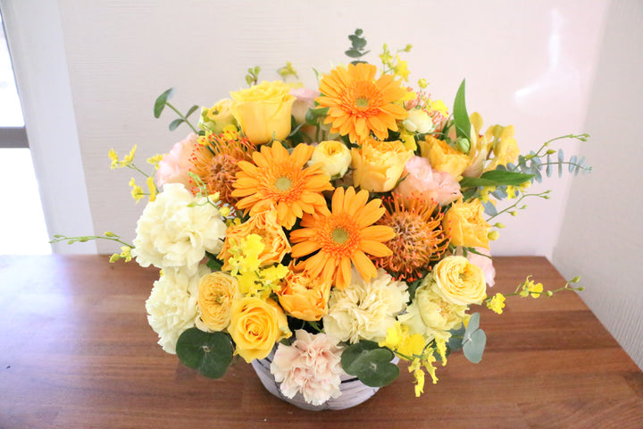 黄色・オレンジ色のアレンジメント 15,000円