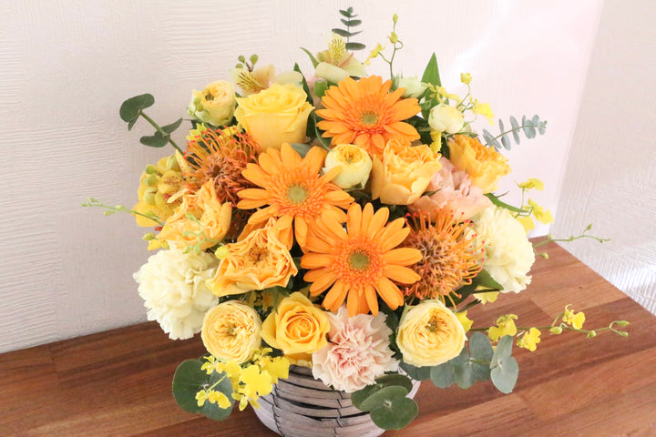 黄色・オレンジ色のアレンジメント 10,000円