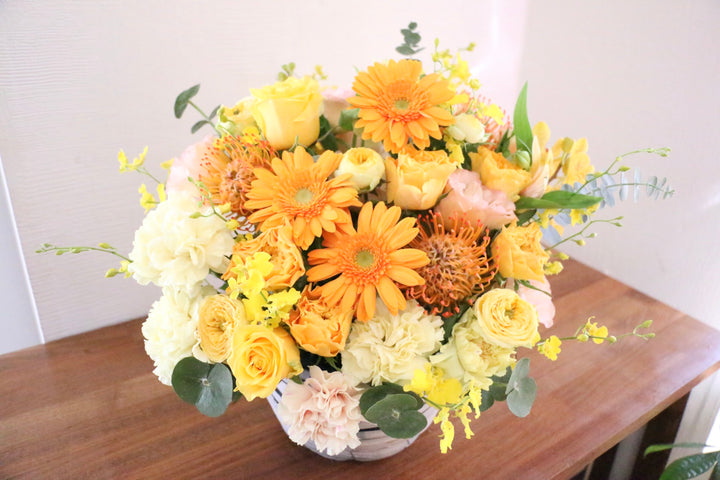 黄色・オレンジ色のアレンジメント 15,000円