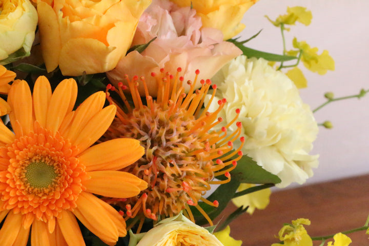 黄色・オレンジ色のアレンジメント 10,000円
