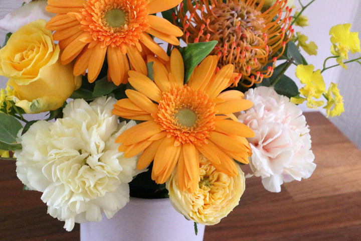黄色・オレンジ色のアレンジメント 7,000円