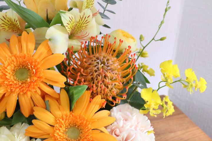 黄色・オレンジ色のアレンジメント 7,000円