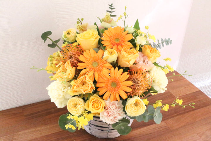 黄色・オレンジ色のアレンジメント 10,000円
